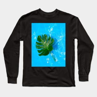 Monstera deliciosa plant floating on blue water Long Sleeve T-Shirt